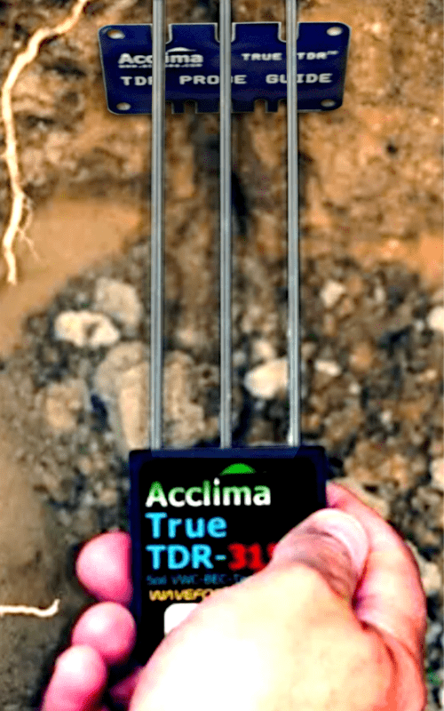 Acclima TDR SDI-12 Soil Moisture Sensor Probing the Soil With a Guide